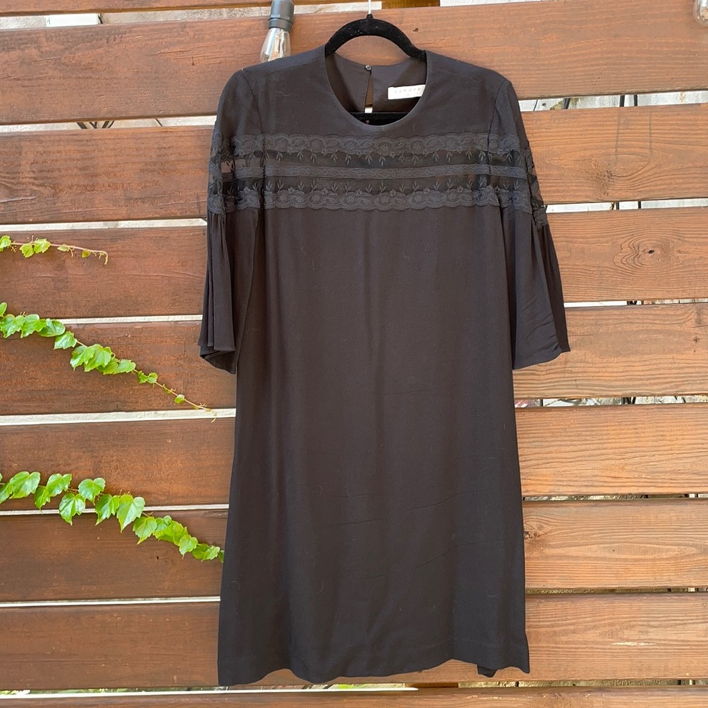 Sandro Paris. Black dress with lace detail.